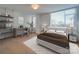 Well-lit bedroom with a desk and shelving, a modern bed and nightstands, and a serene atmosphere at 1300 Queens Rd # 303, Charlotte, NC 28207