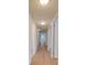 Hallway featuring hardwood floors, neutral walls, and flush mount lighting at 1300 Queens Rd # 303, Charlotte, NC 28207
