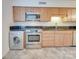 Well-appointed kitchen with stainless steel appliances, tiled floors, and modern cabinets at 1300 Queens Rd # 303, Charlotte, NC 28207