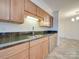 A modern kitchen with stainless steel appliances, nice tile floors, and a breakfast bar at 1300 Queens Rd # 303, Charlotte, NC 28207