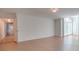 Bright and airy living room featuring hardwood floors and sliding glass door to private patio at 1300 Queens Rd # 303, Charlotte, NC 28207