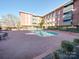 Exterior view of a pool area for a brick apartment complex at 1300 Queens Rd # 303, Charlotte, NC 28207