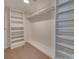 A walk-in closet with built-in shelving and a hanging rod at 1300 Queens Rd # 303, Charlotte, NC 28207