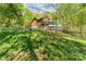 The backyard has an animal pen, providing a functional outdoor space adjacent to wooded area at 15215 Timberview Ln, Huntersville, NC 28078