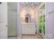 Bathroom with purple walls, a vanity, decorative mirror, and a shower featuring wall art at 15215 Timberview Ln, Huntersville, NC 28078