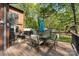 View of back deck with outdoor furniture, table, and a shaded seating area at 15215 Timberview Ln, Huntersville, NC 28078