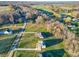 Aerial view of a neighborhood, showcasing beautiful homes, green spaces, and quiet streets at 174 Bellingshire Dr, Mt Ulla, NC 28125