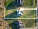 Aerial view of home with large yard, driveway, and ample green space, showing property lines at 174 Bellingshire Dr, Mt Ulla, NC 28125