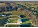 Aerial shot shows a home with large yard, driveway, and ample green space, with property lines at 174 Bellingshire Dr, Mt Ulla, NC 28125