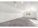 Spacious attic featuring plush carpet, recessed lighting, and natural light from a window at 174 Bellingshire Dr, Mt Ulla, NC 28125