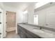 Bathroom featuring a double vanity with gray granite countertop and tile flooring at 174 Bellingshire Dr, Mt Ulla, NC 28125