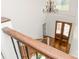 View of a light and airy foyer featuring hardwood floors, elegant chandelier, and staircase with wood and iron railing at 174 Bellingshire Dr, Mt Ulla, NC 28125