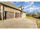 Spacious two-car garage with an extended driveway, offering ample parking and storage at 174 Bellingshire Dr, Mt Ulla, NC 28125