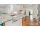 Modern kitchen with white cabinets, granite countertops, and stainless steel appliances at 174 Bellingshire Dr, Mt Ulla, NC 28125
