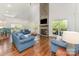Spacious living room with a stone fireplace, hardwood floors, and comfortable seating at 174 Bellingshire Dr, Mt Ulla, NC 28125