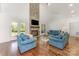 Bright living room with a stone fireplace, hardwood floors, and comfortable seating at 174 Bellingshire Dr, Mt Ulla, NC 28125