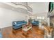 Open-concept living area featuring hardwood floors, fireplace, and access to the kitchen at 174 Bellingshire Dr, Mt Ulla, NC 28125