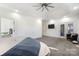 Bright main bedroom with a ceiling fan, tv, and access to an ensuite bathroom and outdoor patio at 174 Bellingshire Dr, Mt Ulla, NC 28125