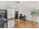 Bright office area with hardwood floors, large windows, and ample natural light at 174 Bellingshire Dr, Mt Ulla, NC 28125