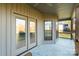Covered patio with double doors and a view of the backyard at 174 Bellingshire Dr, Mt Ulla, NC 28125