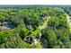 Aerial shot of the property surrounded by mature trees showcasing the location within a lush landscape at 546 Little Cove Ln, Lake Wylie, SC 29710