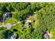 Birds eye view of the house showcasing the mature trees and the location within a lush landscape at 546 Little Cove Ln, Lake Wylie, SC 29710