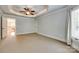 Large bedroom with carpet flooring, a ceiling fan, and three windows to let in natural light at 546 Little Cove Ln, Lake Wylie, SC 29710