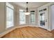 Sunny breakfast nook with hardwood floors, large windows, and access to the outdoors at 546 Little Cove Ln, Lake Wylie, SC 29710