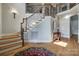 Spacious foyer with a staircase, hardwood floors, and wrought iron railings at 546 Little Cove Ln, Lake Wylie, SC 29710