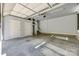 Spacious garage with high ceilings, multiple doorways, and concrete floors at 546 Little Cove Ln, Lake Wylie, SC 29710