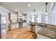 Bright kitchen features stainless steel appliances, granite countertops, and ample cabinet space at 546 Little Cove Ln, Lake Wylie, SC 29710