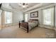 Large main bedroom with tray ceiling, carpet, and lots of natural light at 546 Little Cove Ln, Lake Wylie, SC 29710