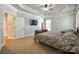 Spacious main bedroom features tray ceilings, neutral carpeting, and large windows at 546 Little Cove Ln, Lake Wylie, SC 29710