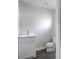 Small half bathroom with white vanity and toilet at 105 Center St, Kings Mountain, NC 28086