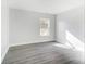 Spacious bedroom with large window and grey wood-look flooring at 105 Center St, Kings Mountain, NC 28086