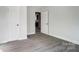 Bright bedroom with grey flooring and an open door to another room at 105 Center St, Kings Mountain, NC 28086