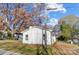 White exterior house with mature trees and a well-maintained yard at 105 Center St, Kings Mountain, NC 28086