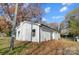 Newly renovated house exterior boasts a clean, white exterior and landscaped yard at 105 Center St, Kings Mountain, NC 28086