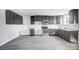 Modern kitchen with dark cabinets, stainless steel appliances and vinyl flooring at 105 Center St, Kings Mountain, NC 28086