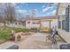 Relaxing backyard patio with fire pit and seating area at 108 Elm St, New London, NC 28127