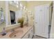 Clean bathroom with double vanity and laundry closet at 108 Elm St, New London, NC 28127