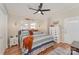 Spacious Primary bedroom with a king-size bed and private access to the bathroom at 108 Elm St, New London, NC 28127