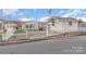 House exterior with white picket fence and storage shed at 108 Elm St, New London, NC 28127