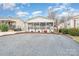 Single story home with screened porch and gravel driveway at 108 Elm St, New London, NC 28127