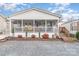 Single story home with screened porch and landscaped yard at 108 Elm St, New London, NC 28127