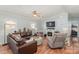 Spacious living room with L-shaped sofa and fireplace at 108 Elm St, New London, NC 28127