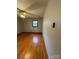 Hardwood floor bedroom with ceiling fan and window at 112 Adcock St, Belmont, NC 28012