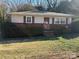 Brick and siding ranch home with well-maintained lawn at 112 Adcock St, Belmont, NC 28012