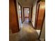 Hallway with carpet and doors to bedrooms at 112 Adcock St, Belmont, NC 28012