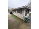 Beige Ranch home with a deck and driveway at 112 Adcock St, Belmont, NC 28012